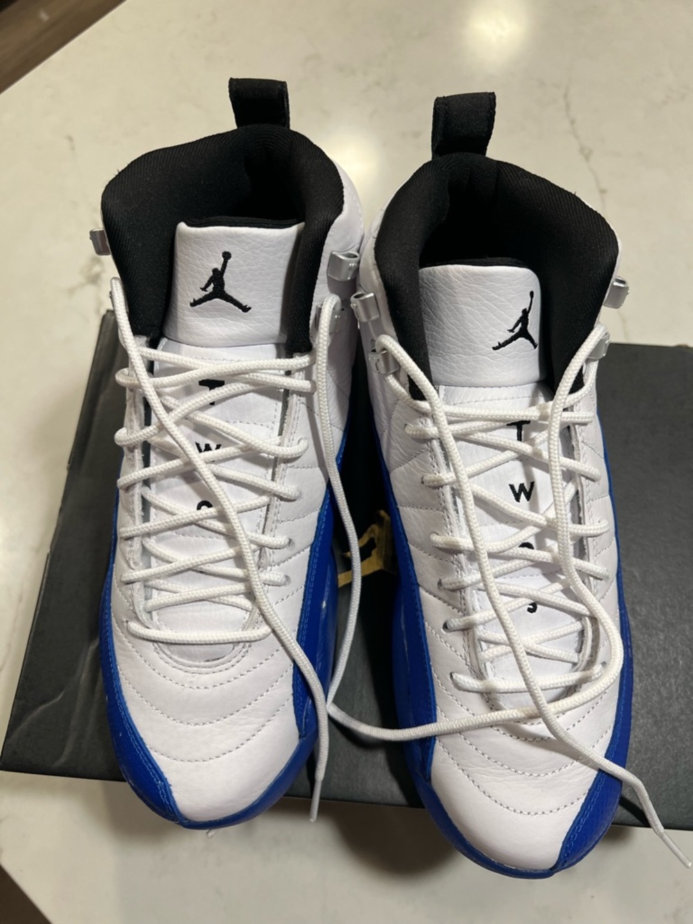 Jordan White and Royal Blue Retro 12 Sneakers - Picture 9 of 13